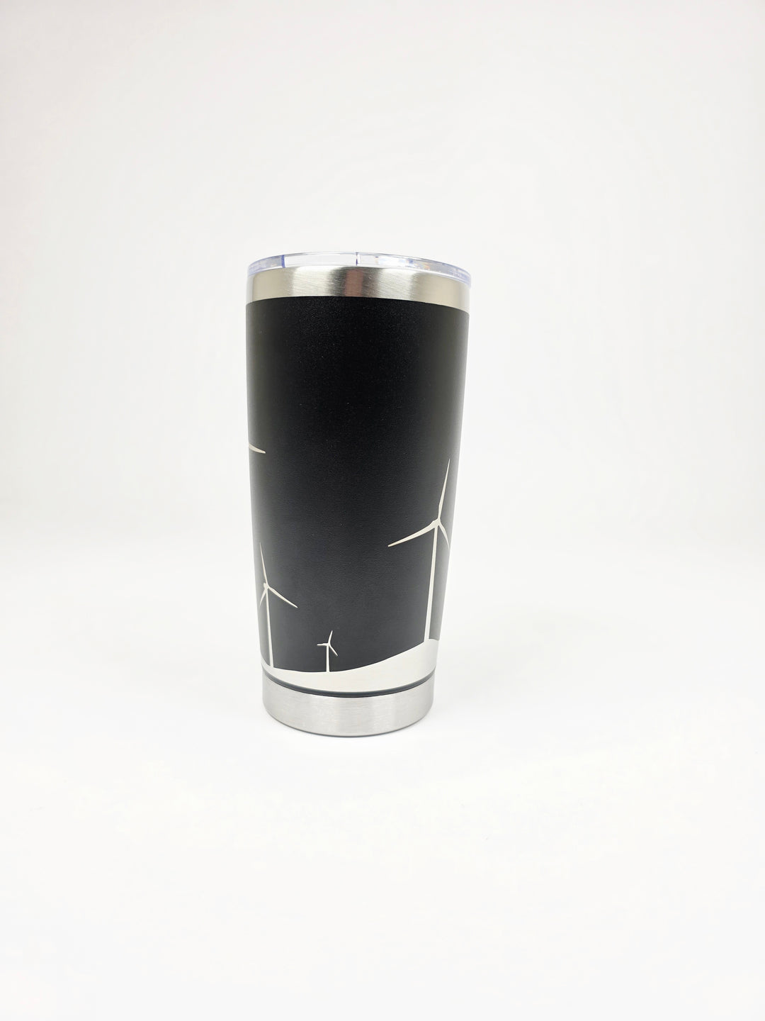 Side angle of black wind turbine tumbler showing distant turbines and horizon line