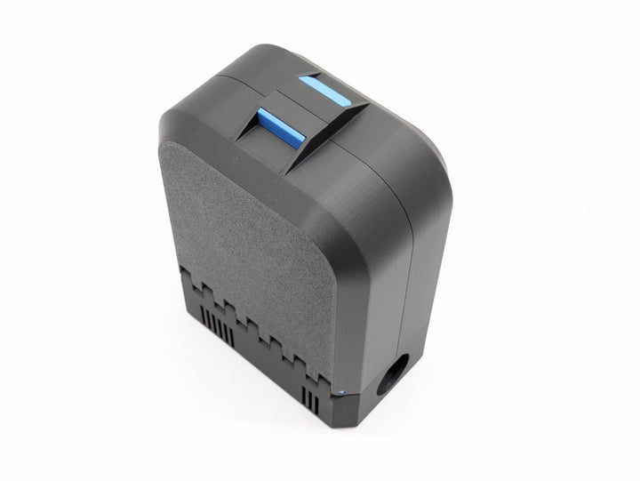 Closed charger-version case standing upright, black with a blue latch
