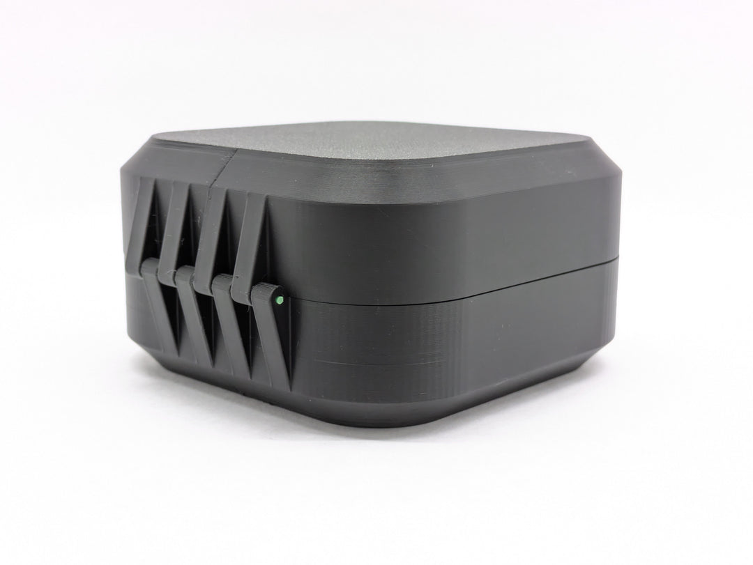 Closed black case from the back, showing the printed hinge