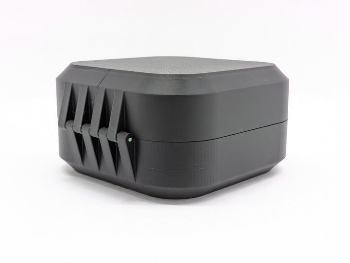 Closed black case from the back, showing the printed hinge