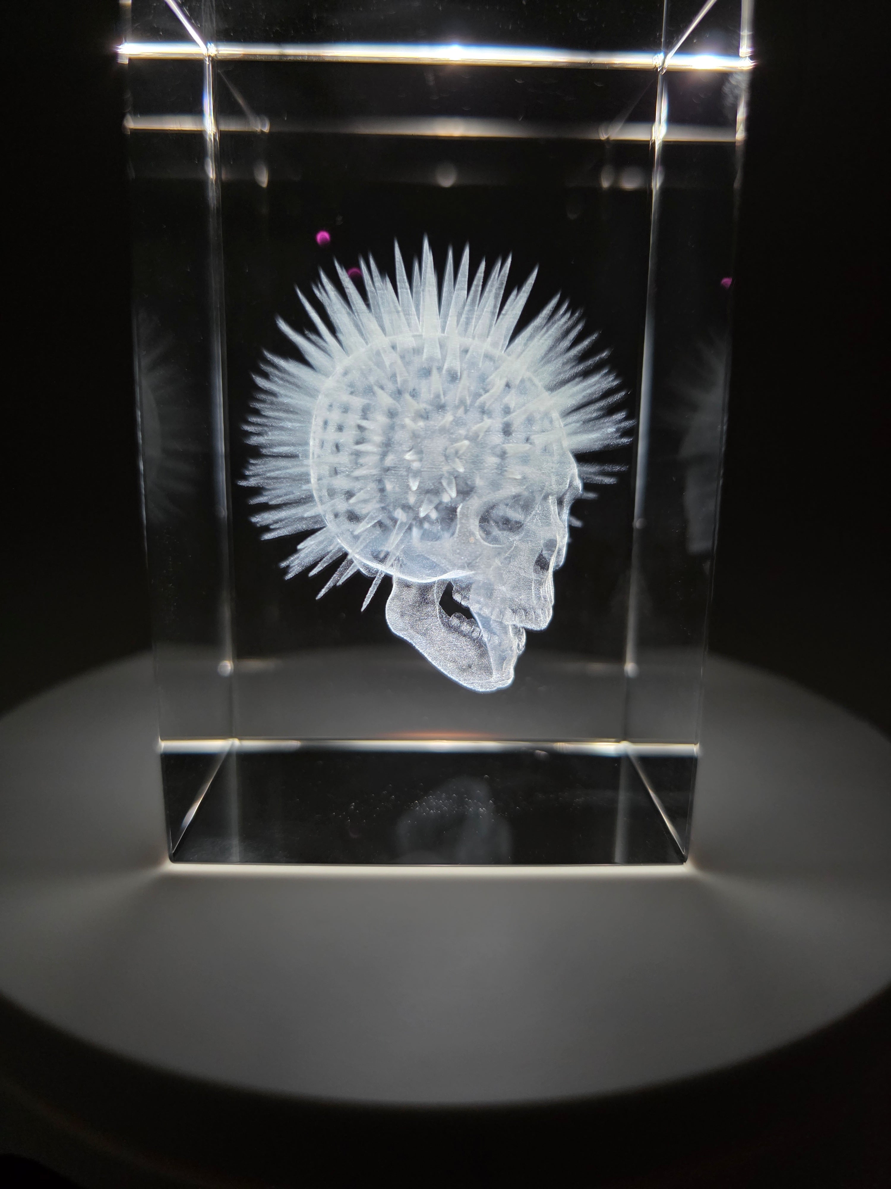 3D laser engraved crystal block with intricate detail on LED light base