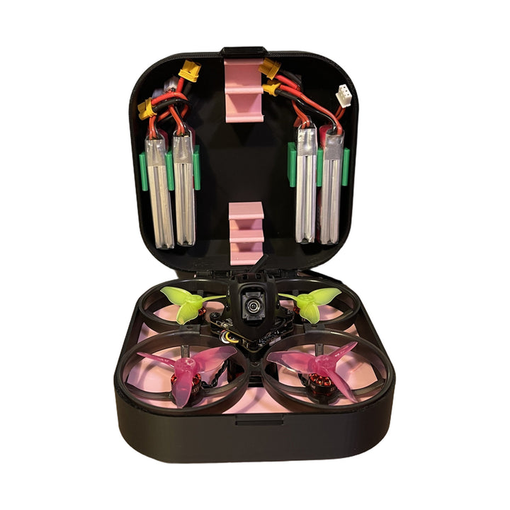 Open Mobula8 Classic drone case with the whoop seated in the base and four 2S batteries clipped into the lid