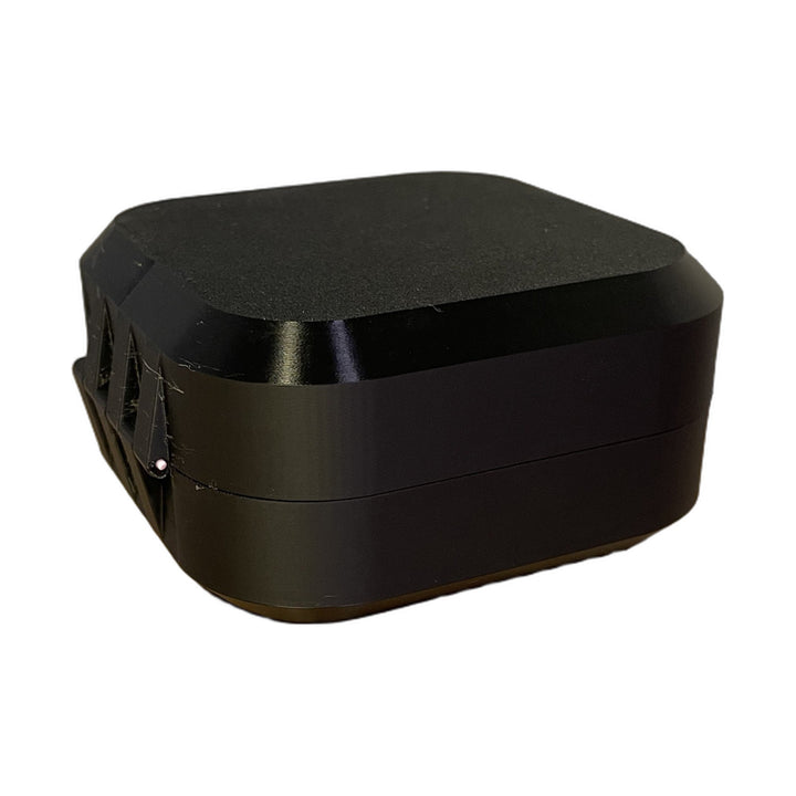 Closed black Mobula8 Classic case from the back corner, showing the printed hinge