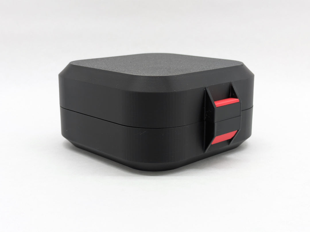 Closed black Elite case from the front, showing the red latch