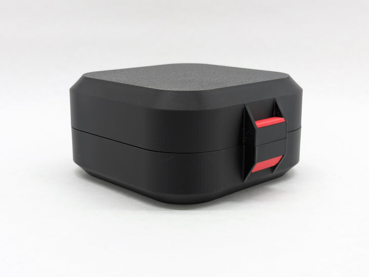 Closed black Elite case from the front, showing the red latch