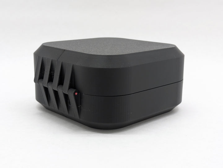 Closed black Elite case from the back, showing the printed hinge