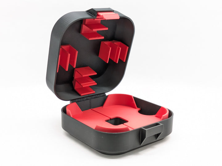 Open black Mobula8 Freestyle case from the side, red battery clips in the lid and the red insert in the base