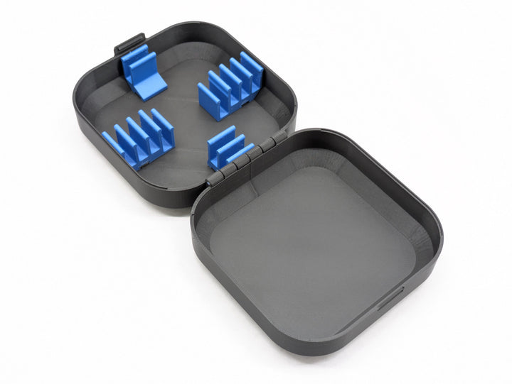 3D printed FPV drone case interior showing the battery clips and empty base tray