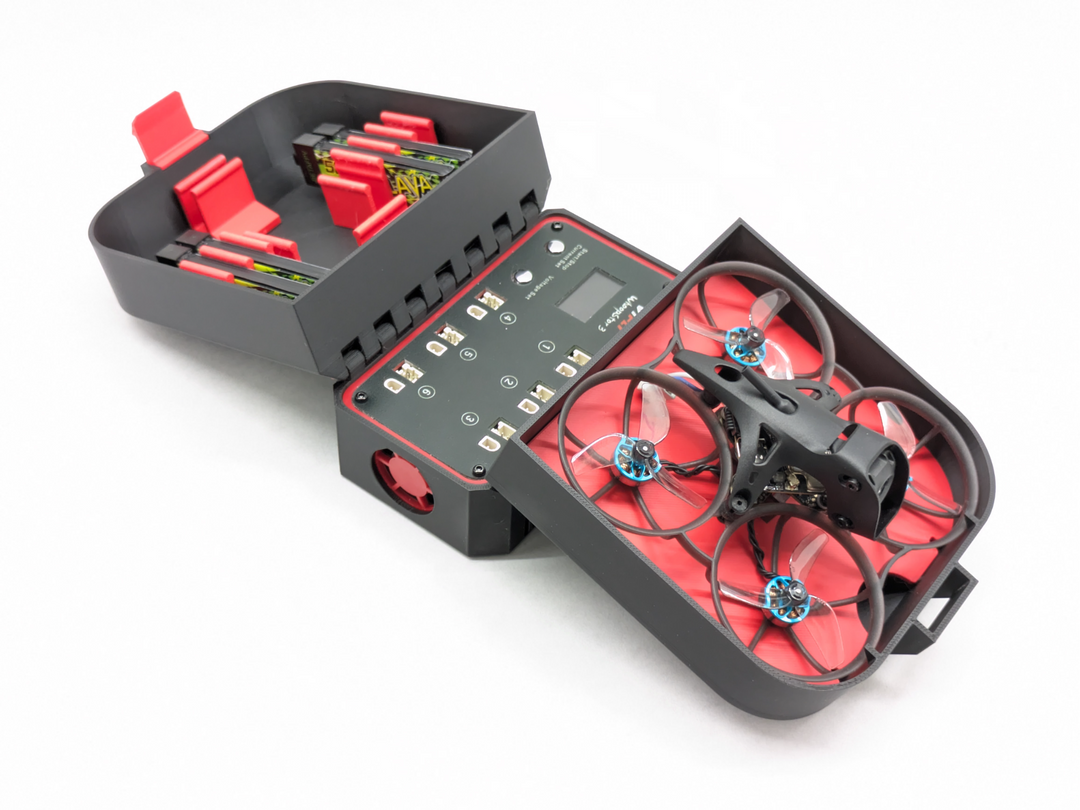 Open 3D printed case holding a BetaFPV Meteor75 Pro, a Vifly Whoopstor V3 charger, and a tray of 1S batteries