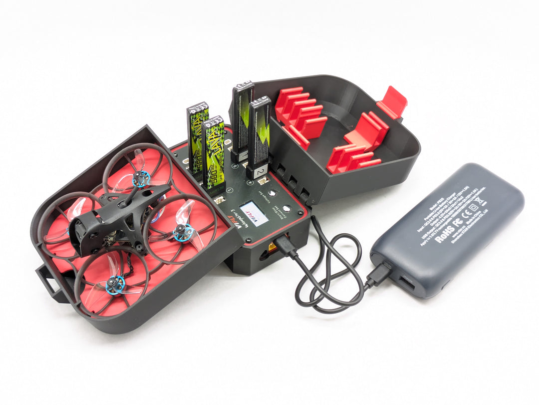 Vifly Whoopstor V3 charging tiny whoop batteries inside the printed case, powered from a USB power bank