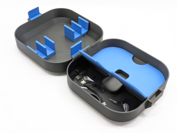 3D printed Pavo20 case interior showing the printed battery clips in the lid tray