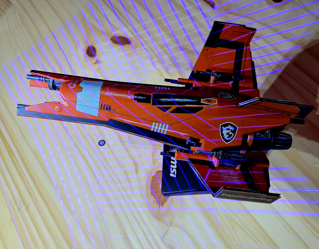 3D scanning in progress - laser grid on model jet